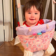 Leah joined the competition — help win amazing prizes! baby, child, clothing, doorway, fabric, face, frame, hair, happy, home, indoor, jumper, person, photo, playtime, seat, smiling, swing, toy, wooden_floor