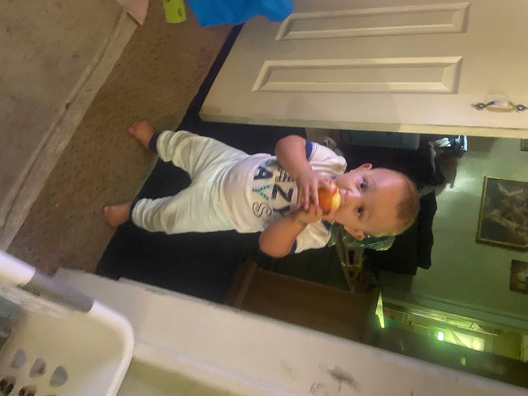 Atticus joined the competition — help win amazing prizes! baby, child, flooring, fun, hardwood, hat, human_leg, person, picture_frame, room, t_shirt, thigh, toddler, wood