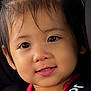 child, toddler, car_seat, car, seat_belt, portrait, smiling, red_shirt, black_harness, close_up, face, hair, cute, indoors, safety, baby, childseat, seat, young_child, person