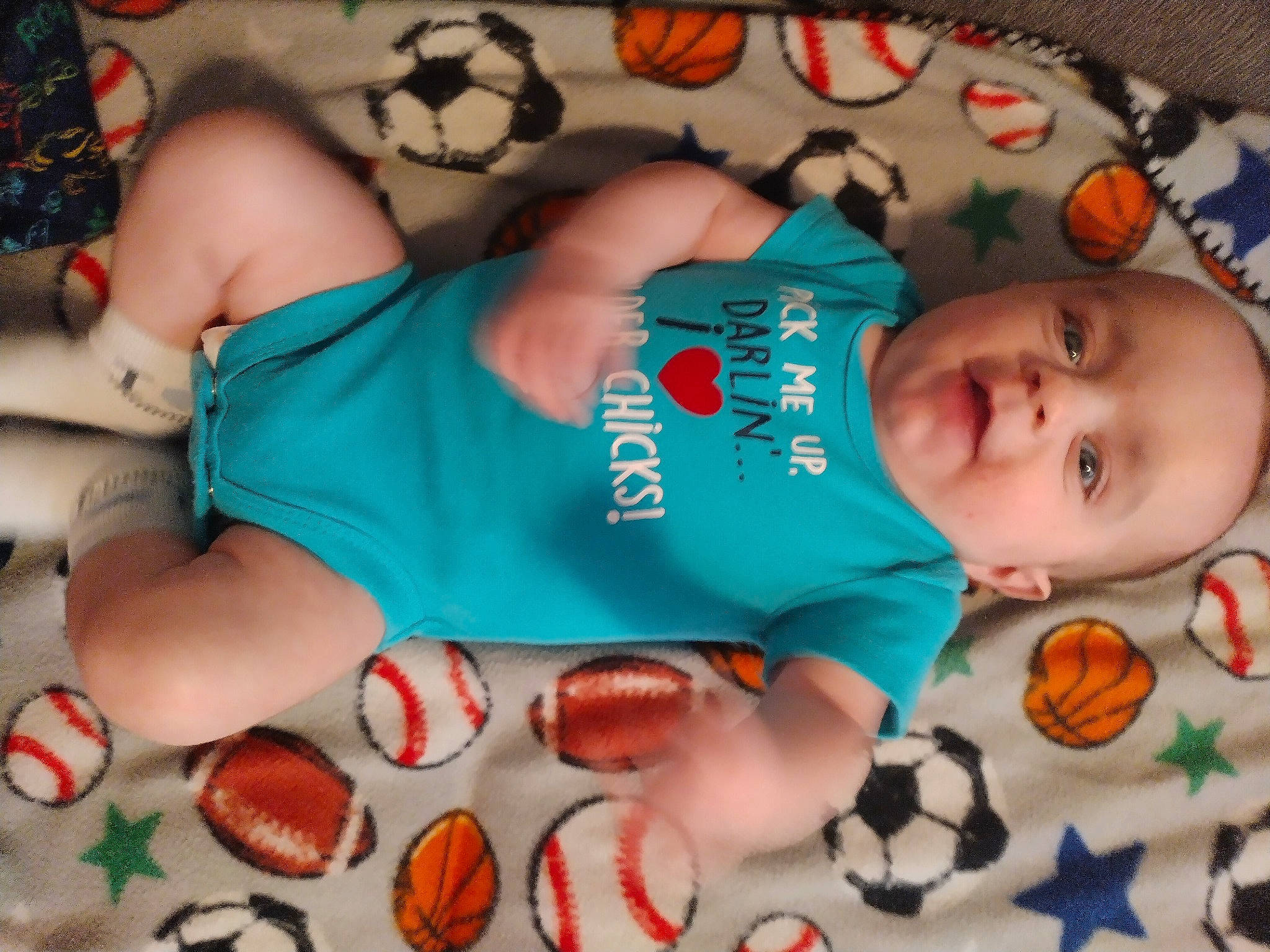 Grayson is registered to the contest to win money with this photo: baby, baby_products, baby_toddler_clothing, blue, cheek, child, comfort, eye, hand, head, human_body, linens, mouth, nail, orange, person, skin, textile, thigh, toddler