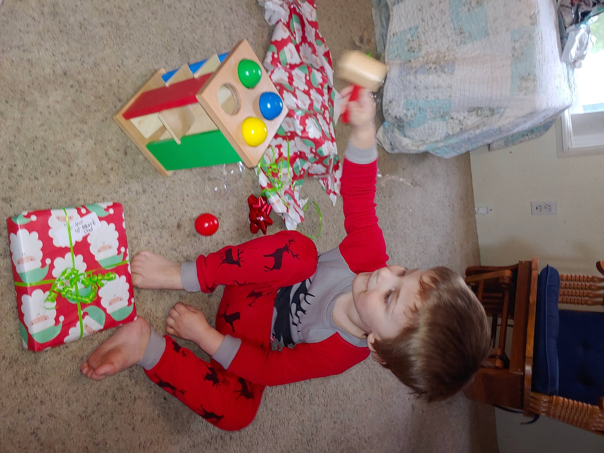 Nico joined the competition — help win amazing prizes! carmine, chair, child, christmas, christmas_decoration, christmas_eve, event, fun, happy, holiday, joy, leisure, party_supply, pattern, person, play, room, sitting, sock, textile