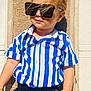 Emir joined the competition — help win amazing prizes! child, toddler, sunglasses, striped_shirt, blue, white, black_pants, standing, outdoor, sunlight, fashion, attitude, wall, texture, portrait, casual, hair, person, clothing, summer