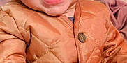 Emir joined the competition — help win amazing prizes! baby, child, smiling, jacket, orange_jacket, portrait, cute, happy, face, person, indoor, clothing, young_child, warm_clothes, buttoned_jacket, sitting, closeup, skin, hair, eyes