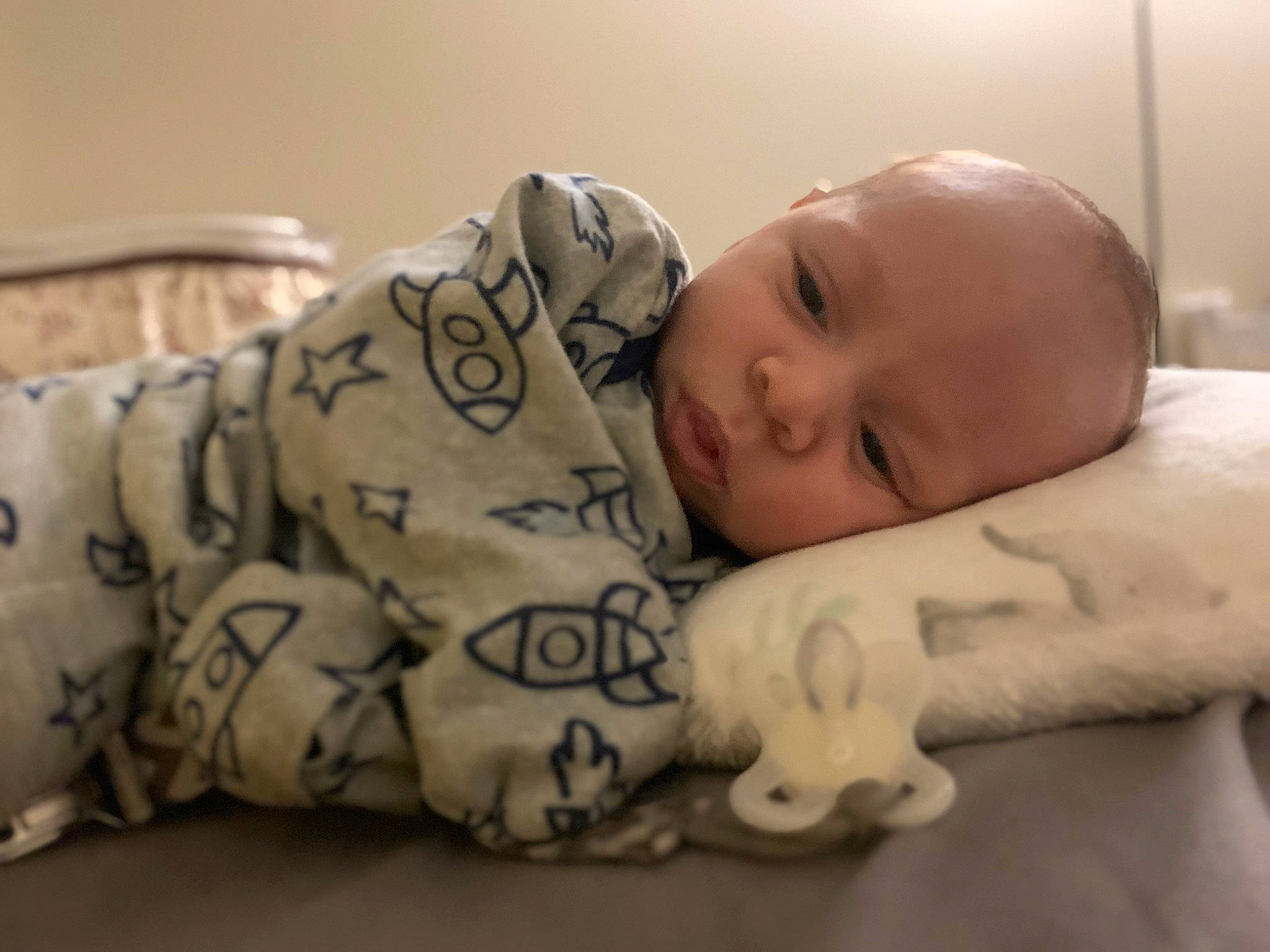 Graysen is registered to the contest to win money with this photo: arm, baby, baby_toddler_clothing, bedtime, cheek, child, comfort, eyebrow, face, flooring, head, human_body, linens, person, portrait_photography, room, sitting, skin, sleep, sleeve