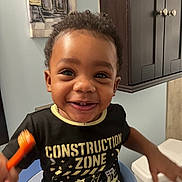 Danzir is registered to the contest to win money with this photo: baby_walker, bathroom, cabinet, child, construction_zone, cute, decor, expression, face, furniture, hair, happy, indoor, person, shirt, smiling, teeth, toddler, toothbrush, wall_art