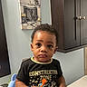 Danzir joined the competition — help win amazing prizes! bathroom, black_shirt, blue_chair, cabinet, child, construction_zone, curly_hair, facial_expression, furniture, holding_object, indoor, mirror, painting, person, plumbing, potty, sink, toddler, toothbrush, young_child