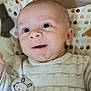 Gaetan a rejoint le concours — aidez-le/la à gagner de superbes lots ! baby, infant, face, eyes, smile, newborn, onesie, bunny_clip, polka_dot, patterned_blanket, cheek, ear, hand, closeup, portrait, indoors, soft_toy_shadow, fabric, cute, gaze