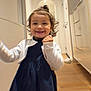 Esra a rejoint le concours — aidez-le/la à gagner de superbes lots ! toddler, child, smiling, dress, white_jacket, hair_tie, indoor, hallway, wooden_floor, happy, person, portrait, motion_blur, young_child, cute, celebration, fist, small_hair_bun, light, wall