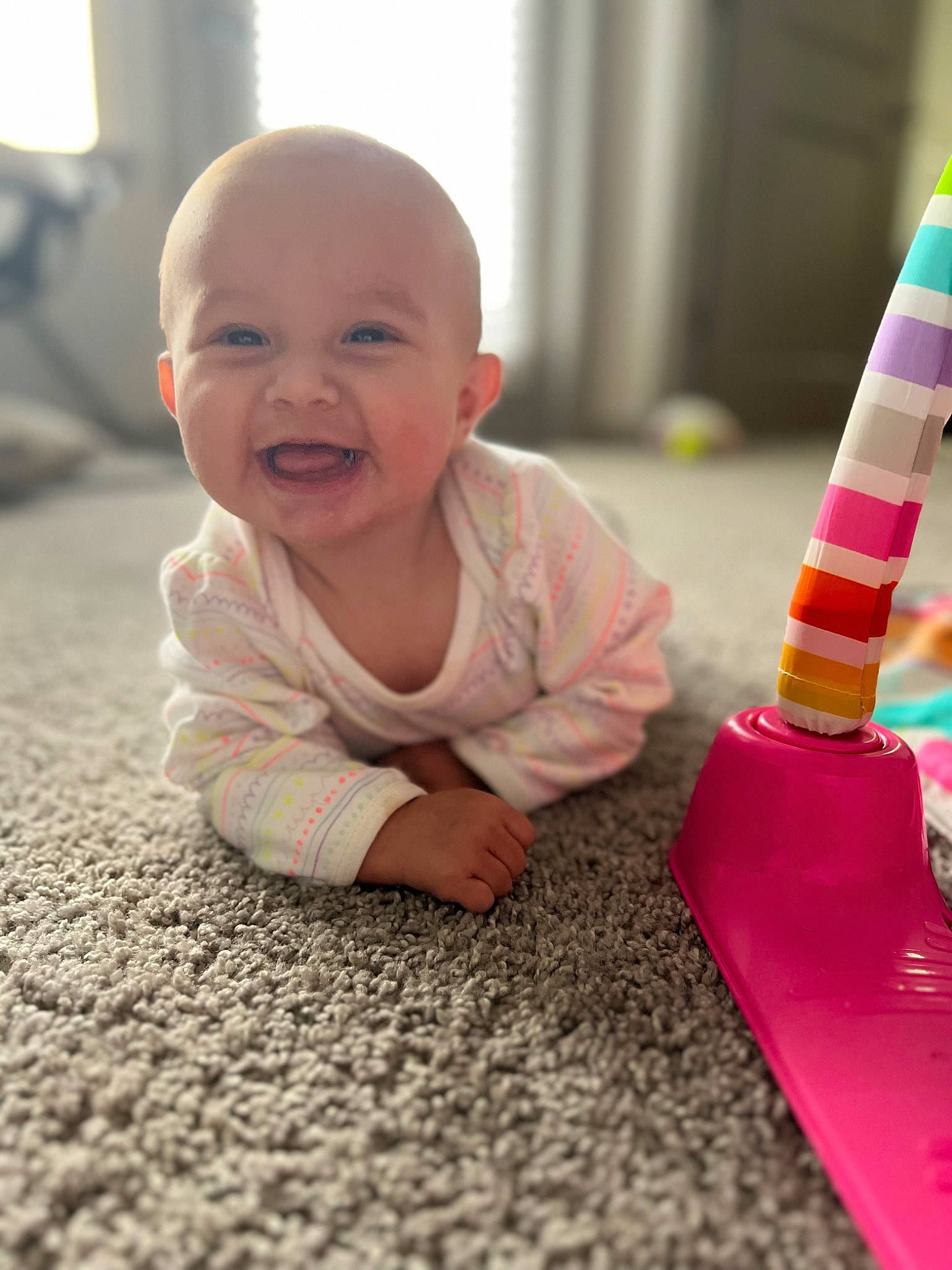 Eleanor is registered to the contest to win money with this photo: baby, baby_playing_with_toys, baby_toddler_clothing, cheek, child, crawling, eye, finger, floor, flooring, fun, happy, joy, people, person, product, sitting, skin, smile, standing