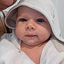 Skyler is registered to the contest to win money with this photo: adult, baby, child, closeup, cloth, cute, expression, eyes, face, hood, indoors, infant, mouth, parent, person, portrait, skin, soft, towel, white