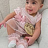 adorable, armchair, baby, child, curly_hair, cute, earrings, fluffy, happy, indoors, infant, pigtails, pink_clothing, portrait, sitting, six_months, smiling, socks, soft_texture, tutu