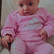 Selena participe au concours pour gagner de l'argent avec cette photo : baby, infant, child, pink_clothing, tracksuit, adidas, sitting, indoor, portrait, blue_eyes, blonde_hair, cozy, cute, soft_lighting, sock, casual_wear, hand, face, young_child, comfort