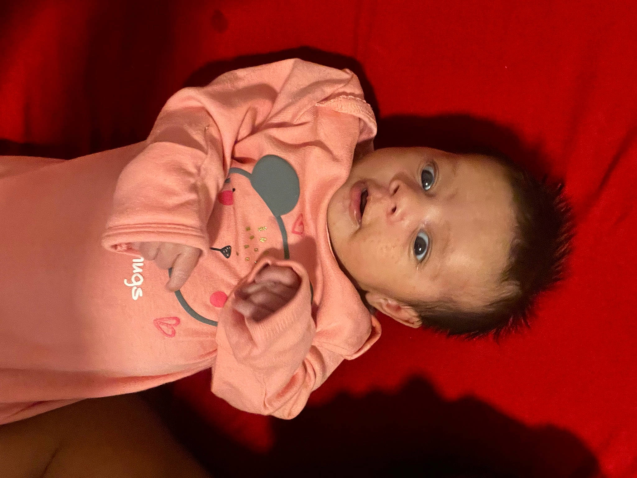 Kailani is registered to the contest to win money with this photo: baby, baby_toddler_clothing, cheek, chin, comfort, eye, eyebrow, finger, flash_photography, fun, human_body, lip, mouth, neck, nose, orange, person, pink, skin, sleeve