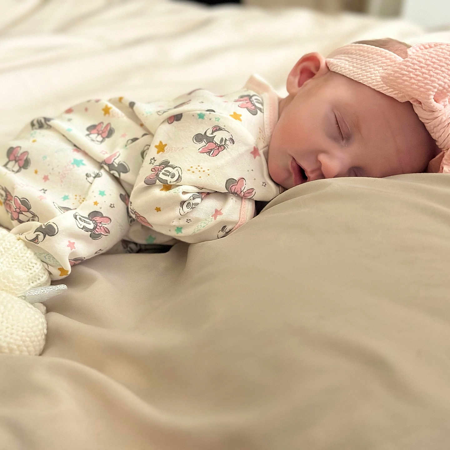 Riley is registered to the contest to win money with this photo: baby, blanket, bonnet, clothing, face, happy, hat, head, newborn, person, sleeping, smile, yawning
