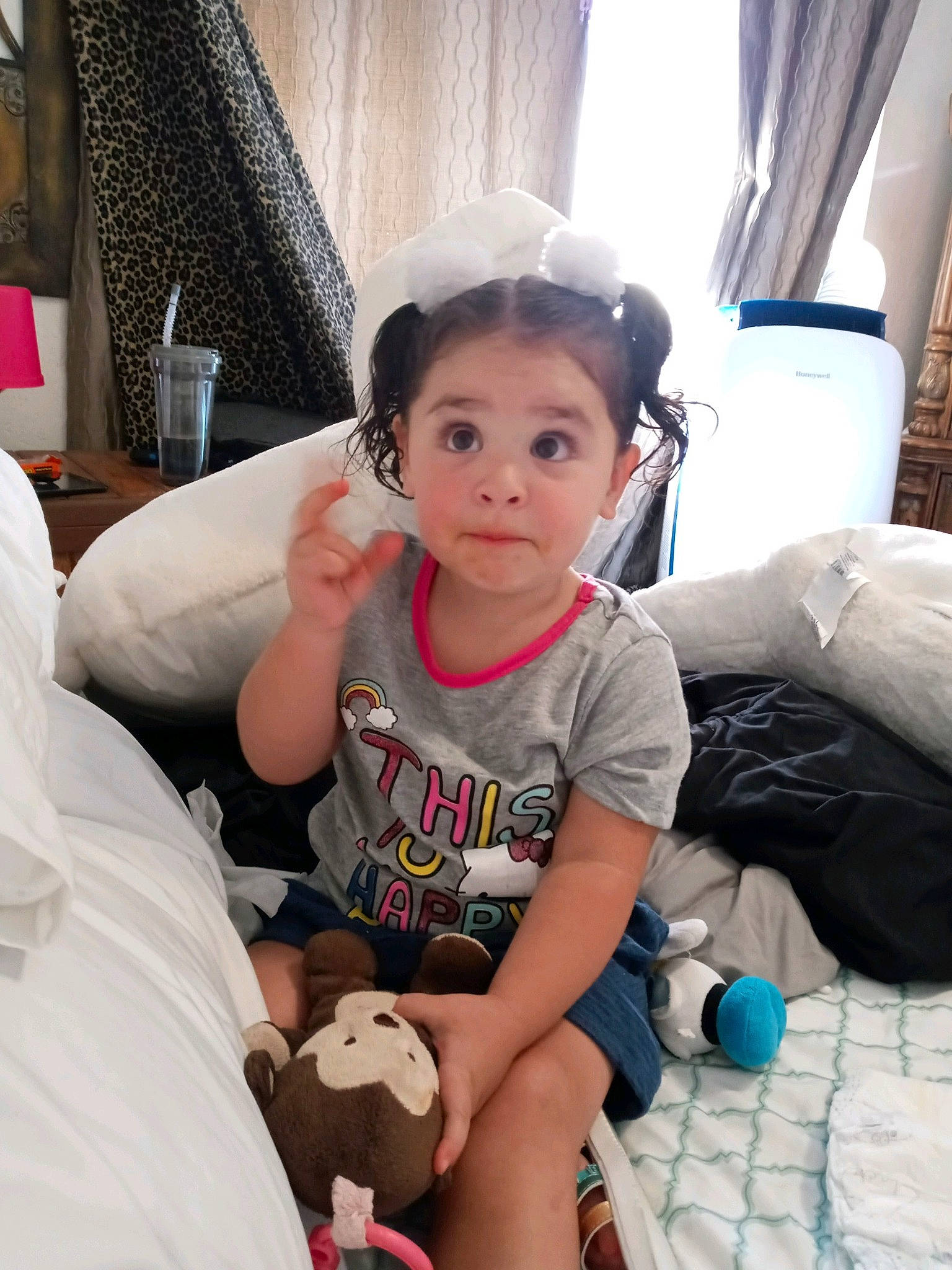 Aubriella is registered to the contest to win money with this photo: baby_toddler_clothing, baby_toys, comfort, curtain, ear, eyelash, hair_accessory, home_accessories, interior_design, linens, mouth, nose, person, picture_frame, plush, stuffed_toy, surprise, textile, toddler, toy