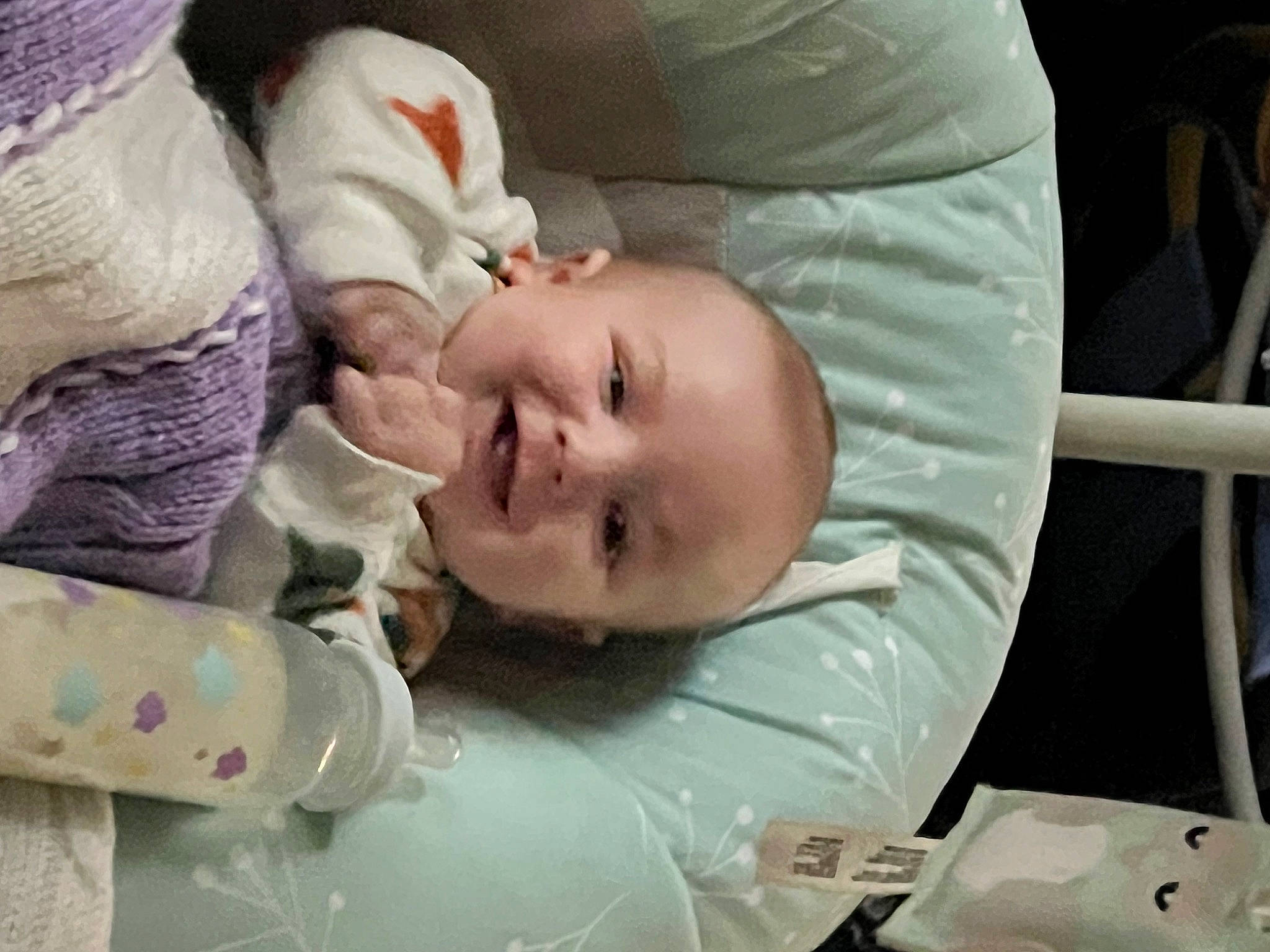 Robert is registered to the contest to win money with this photo: baby, baby_products, baby_toddler_clothing, bedtime, cheek, child, comfort, eye, eyebrow, face, happy, iris, linens, mouth, person, room, skin, sleep, sleeve, smile