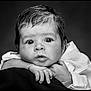 baby, black_and_white, portrait, face, hands, curious, resting, eyes, infant, clothing, soft_texture, close_up, expression, monochrome, studio, newborn, cute, person, child, young