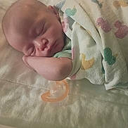Liam joined the competition — help win amazing prizes! newborn, baby, sleeping, infant, portrait, face, blanket, swaddled, pacifier, bed, bedding, cozy, indoors, resting, closed_eyes, arm, head, nursery, soft_lighting, peaceful