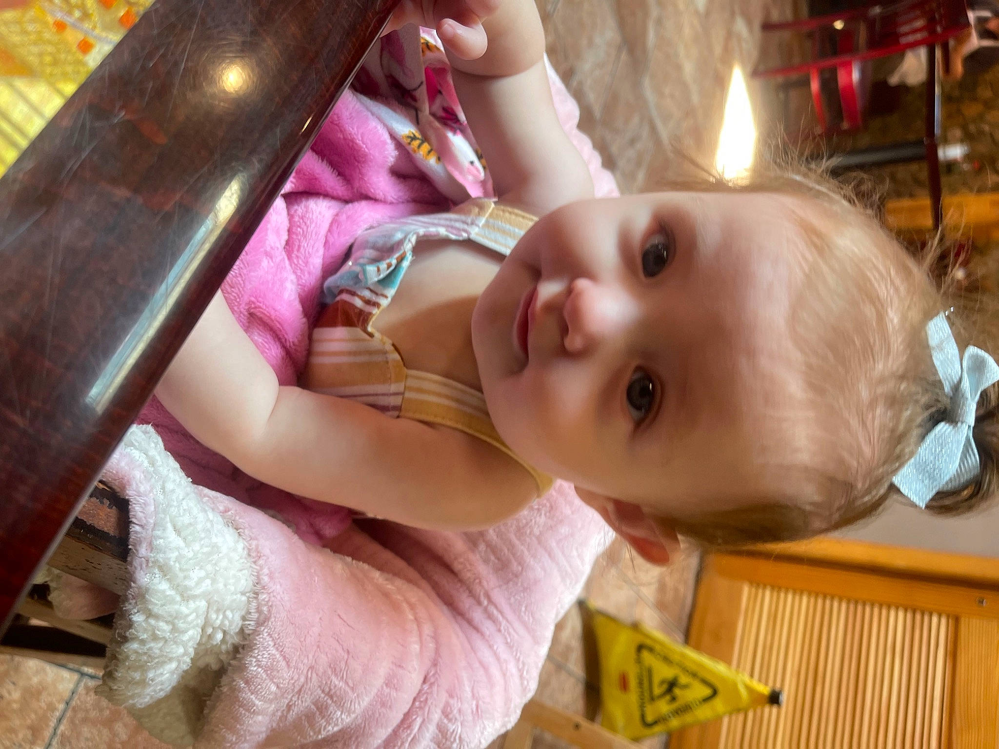 Amelia is registered to the contest to win money with this photo: baby, baby_products, baby_toddler_clothing, cheek, child, ear, event, facial_expression, fun, happy, iris, magenta, nose, person, room, skin, smile, toddler, vacation, wood