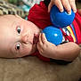Kage is registered to the contest to win money with this photo: baby, child, blue_balls, red_shirt, tongue_out, close_up, face, hand, indoor, soft_focus, cute, infant, playing, person, skin, expression, toy, young_child, lying_down, cozy