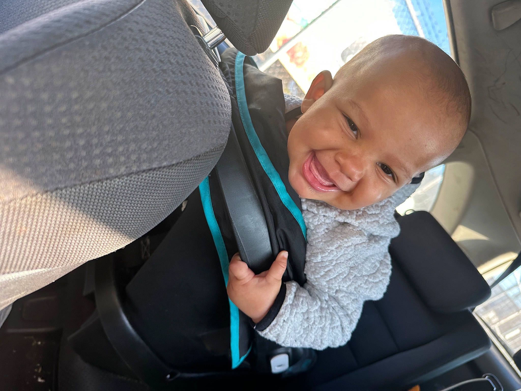 Lionel is registered to the contest to win money with this photo: auto_part, automotive_design, automotive_exterior, automotive_lighting, baby, baby_carriage, baby_products, car, car_seat, car_seat_cover, comfort, mode_of_transport, motor_vehicle, person, product, seat_belt, smile, toddler, vehicle, vehicle_door