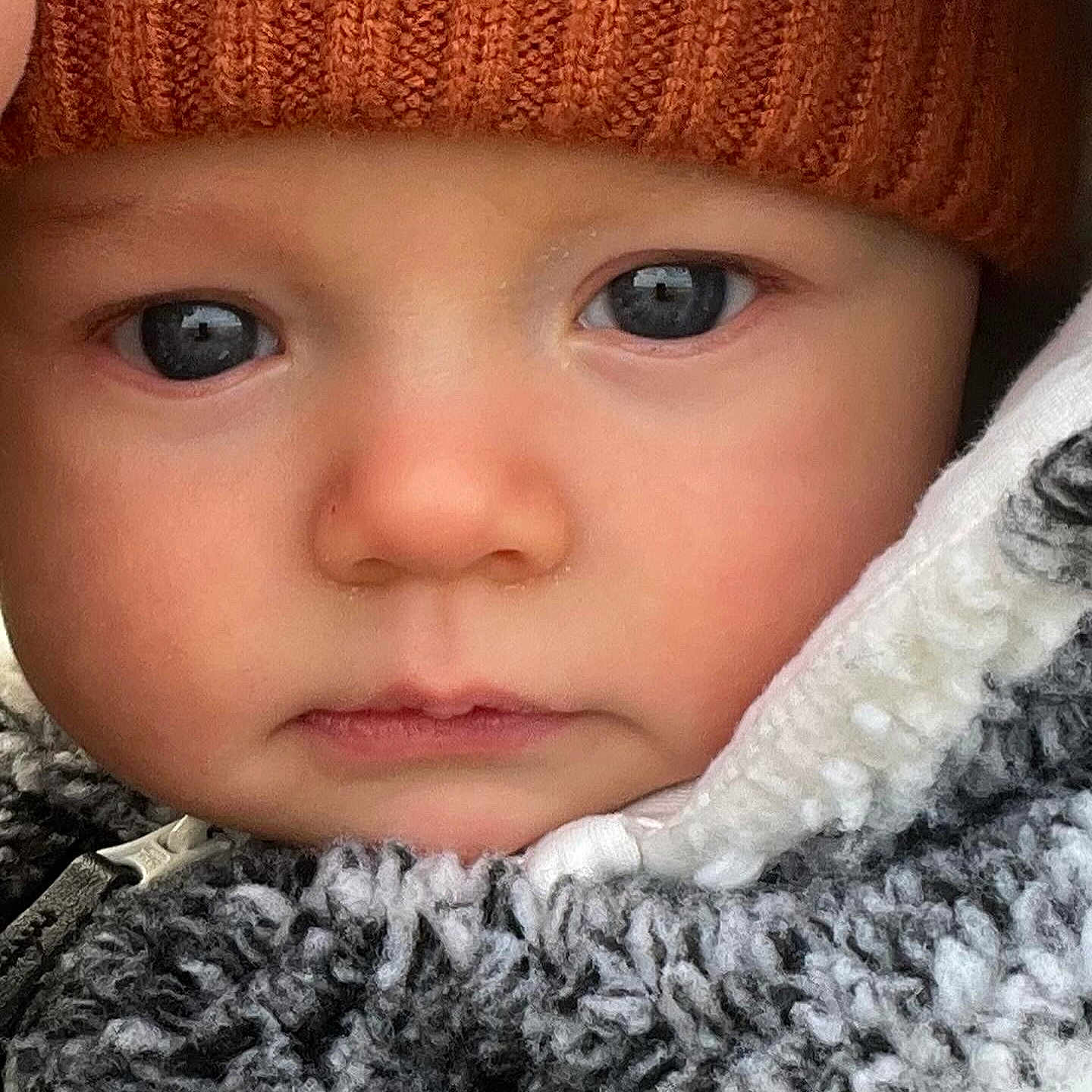 Jayden joined the competition — help win amazing prizes! baby, beanie, bonnet, cap, clothing, coat, face, frown, hat, head, hood, hoodie, jacket, knitwear, person, photography, portrait, sad, sweater, sweatshirt
