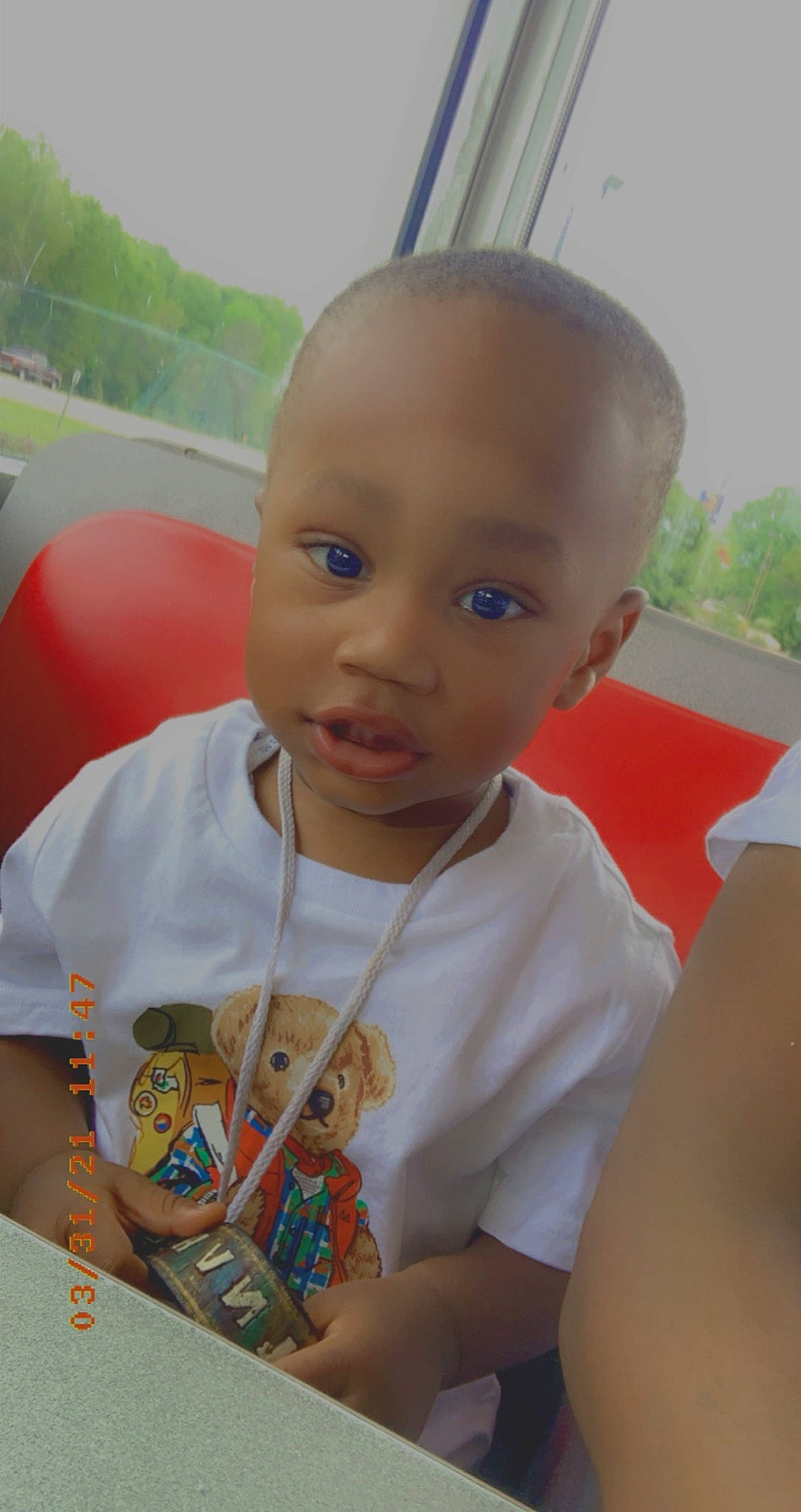 Brycen is registered to the contest to win money with this photo: baby_toddler_clothing, child, chin, facial_expression, finger, fun, grass, hairstyle, happy, head, leisure, nose, people, person, recreation, skin, smile, summer, t_shirt, toddler