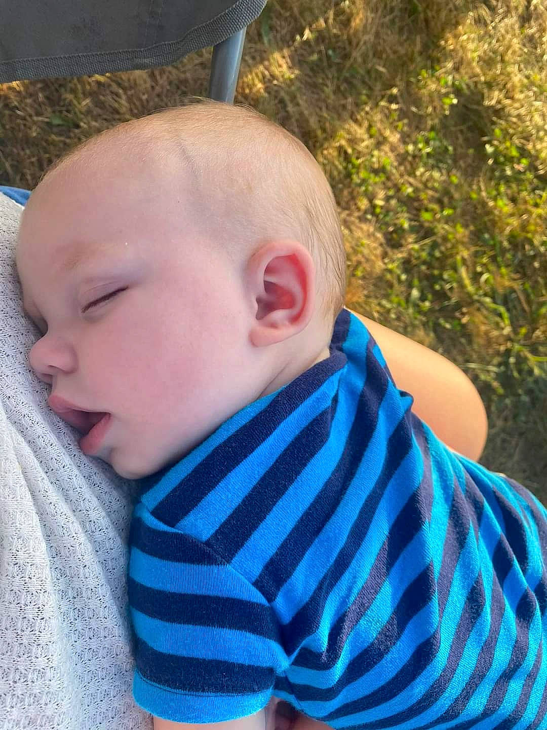 Tanner is registered to the contest to win money with this photo: azure, baby, baby_toddler_clothing, cheek, cool, electric_blue, eye, grass, happy, head, iris, neck, nose, person, plant, skin, sleeve, summer, toddler, tree