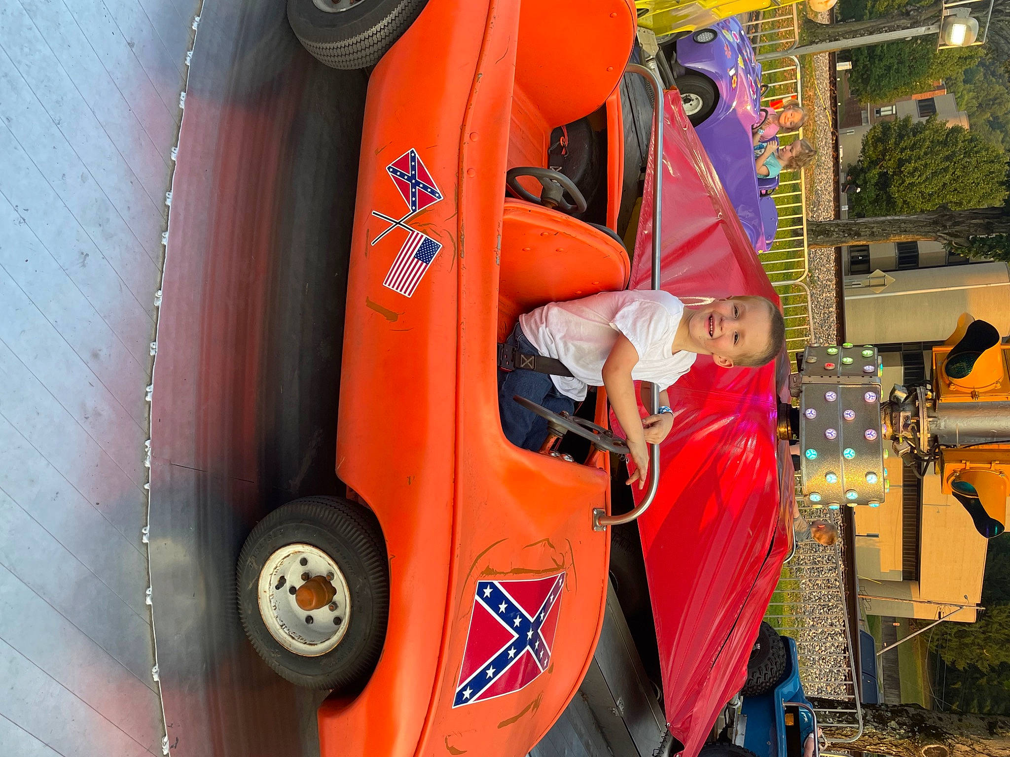 Dustin joined the competition — help win amazing prizes! automotive_design, automotive_exterior, automotive_lighting, automotive_tire, automotive_wheel_system, bumper, car, door, fender, hood, joy, motor_vehicle, orange, person, rim, rolling, tire, tread, vehicle, vehicle_door