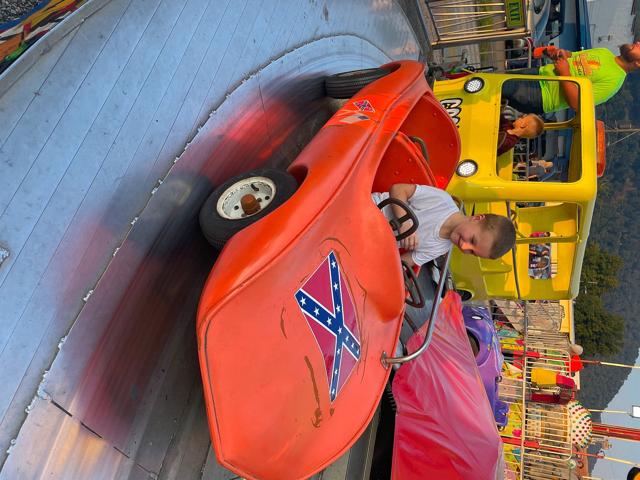 Dustin joined the competition — help win amazing prizes! auto_part, automotive_design, automotive_exterior, automotive_lighting, automotive_tire, automotive_wheel_system, automotive_window_part, bumper, car, classic, engineering, fender, headwear, hood, joy, machine, motor_vehicle, orange, person, personal_protective_equipment