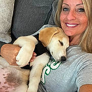Nilli Rae joined the competition — help win amazing prizes! woman, puppy, dog, smiling, sleeping, couch, indoor, casual, light_hair, tshirt, pet, happy, closeup, relaxed, affection, holding, comfortable, resting, face, human