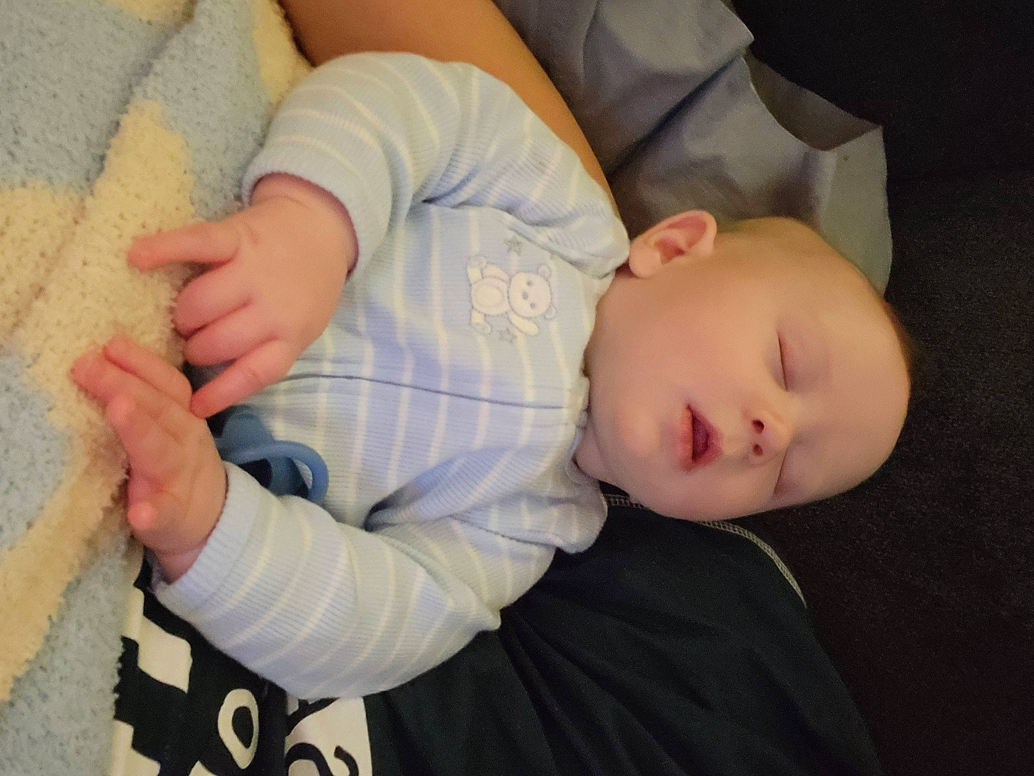 Connor is registered to the contest to win money with this photo: arm, baby, baby_sleeping, baby_toddler_clothing, bedtime, cheek, child, comfort, elbow, gesture, nap, person, sitting, sleep, sleeve, t_shirt, thumb, toddler, tree, wood