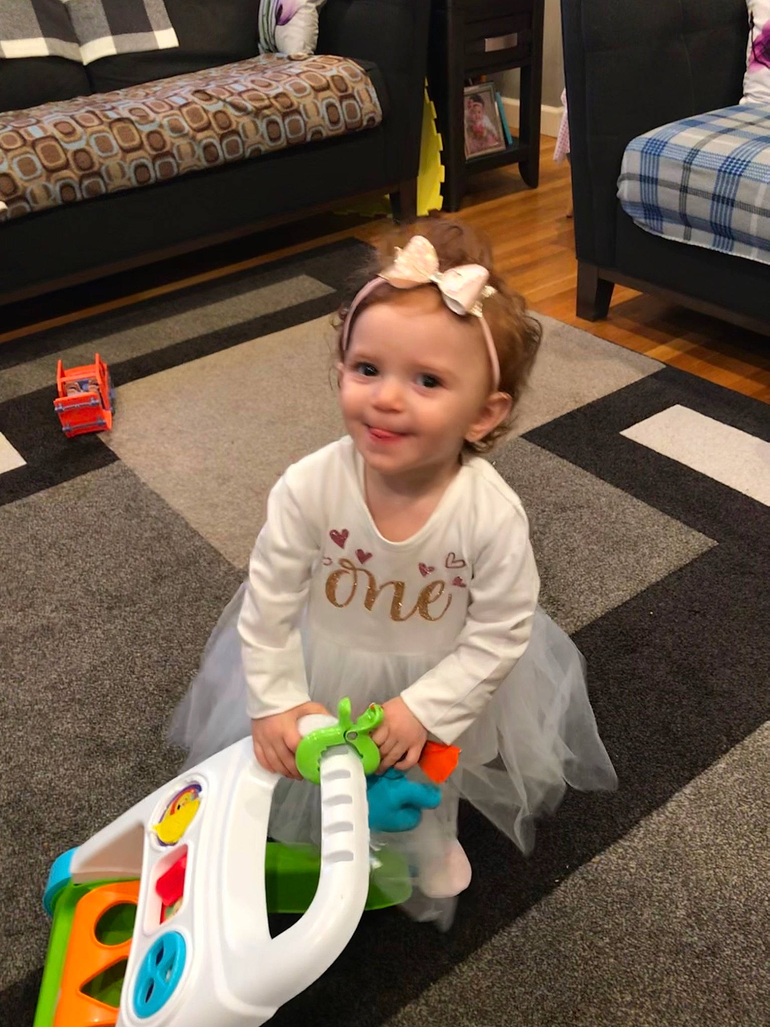 Luisa joined the competition — help win amazing prizes! baby, baby_playing_with_toys, baby_products, baby_toddler_clothing, baby_toys, child, couch, event, flooring, fun, happy, joy, person, play, room, sitting, smile, t_shirt, toddler, toy