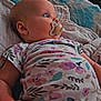 Aurora joined the competition — help win amazing prizes! baby, pacifier, floral_onesie, bed, blanket, pillow, infant, sleepwear, skin, hand, blue_eyes, head, face, lying_down, indoors, child, newborn, cute, resting, soft