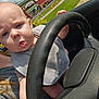 Aurora joined the competition — help win amazing prizes! baby, child, drool, steering_wheel, car_interior, person, hand, seat, clothing, sunlight, road, grass, building, window, face, expression, outdoor, adult, vehicle, seatbelt
