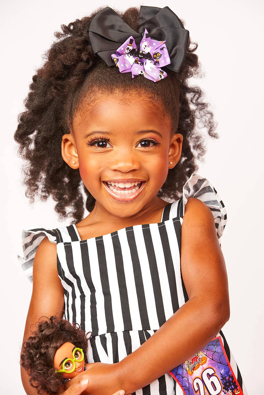 Rylie joined the competition — help win amazing prizes! beauty, black, child, costume_hat, day_dress, face, fashion_accessory, fashion_design, flash_photography, fun, gesture, happy, headpiece, jewellery, joy, magenta, person, skin, smile, t_shirt