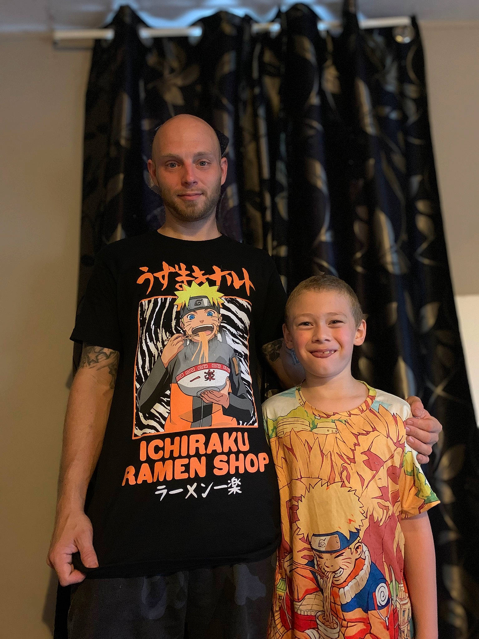 Dustin is registered to the contest to win money with this photo: active_shirt, black, curtain, event, fashion_design, font, fun, happy, joy, logo, person, room, shoulder, sleeve, smile, t_shirt, top, visual_arts