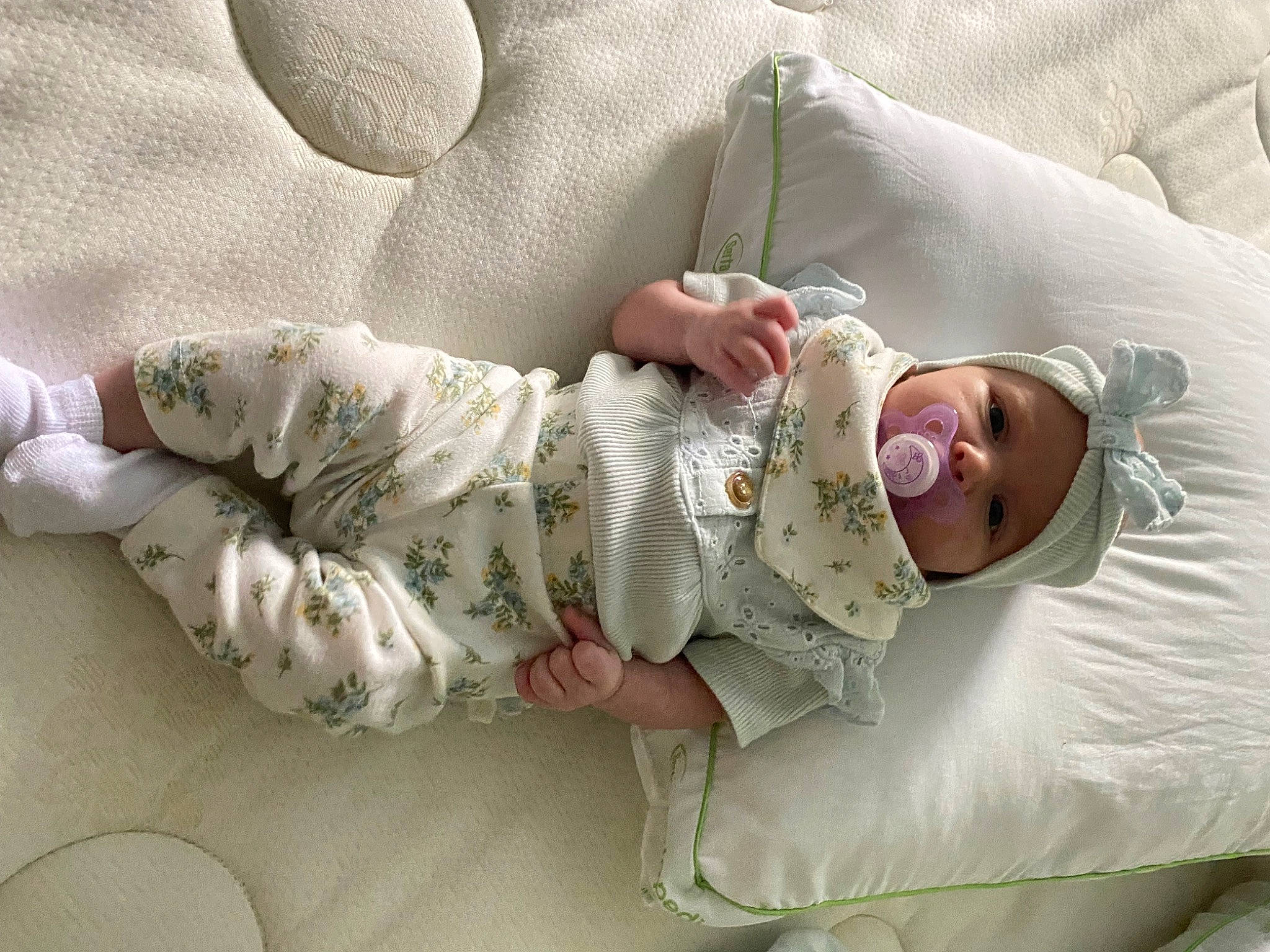 Madilynn is registered to the contest to win money with this photo: arm, baby, baby_products, baby_sleeping, baby_toddler_clothing, bedding, bedtime, child, comfort, foot, hand, head, headwear, linens, nap, person, product, room, skin, sleep