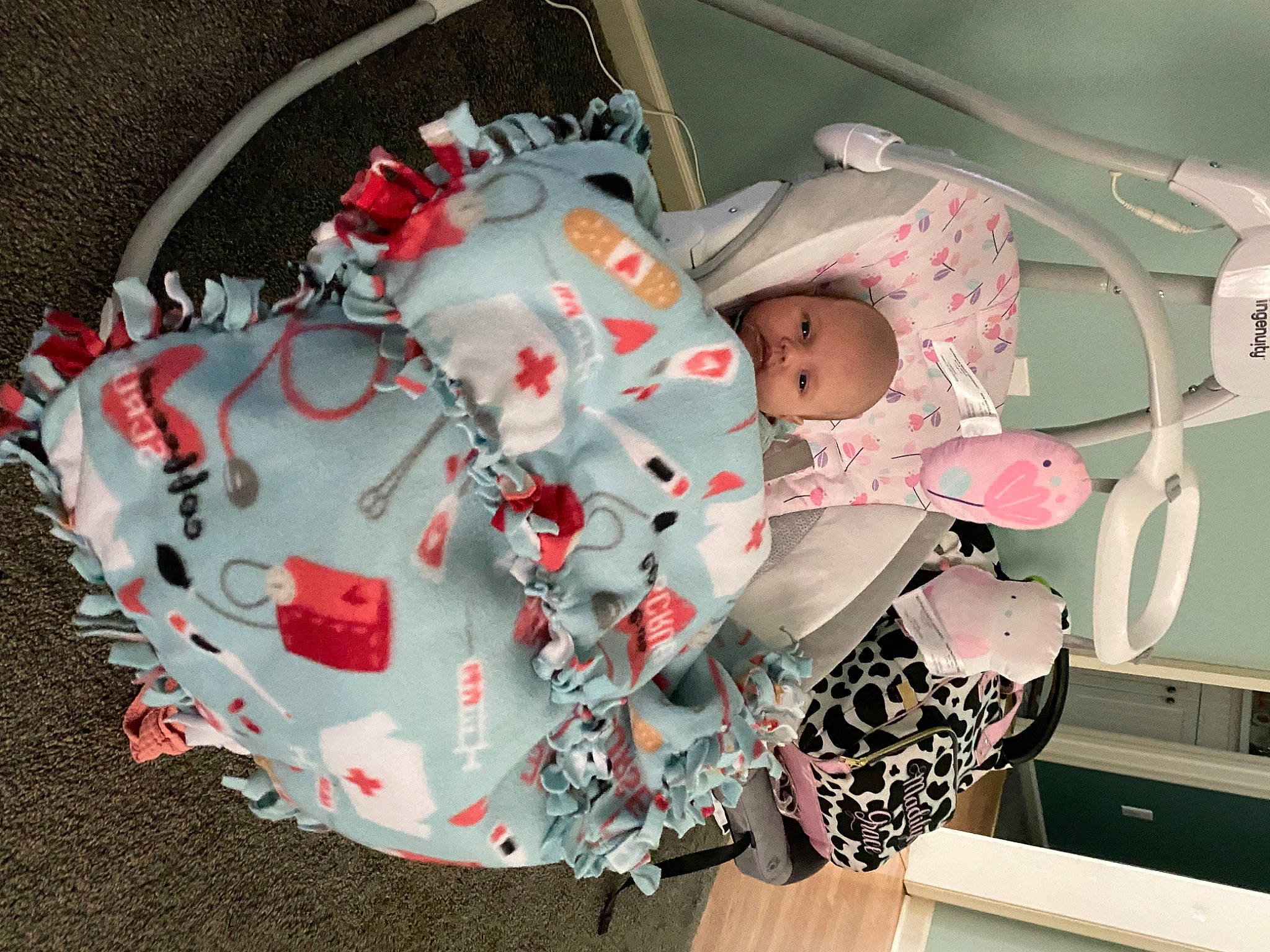 Madilynn is registered to the contest to win money with this photo: baby, baby_carriage, baby_products, baby_safety, baby_toddler_clothing, baby_toys, carmine, child, event, linens, pattern, person, personal_protective_equipment, pink, plastic, room, toddler