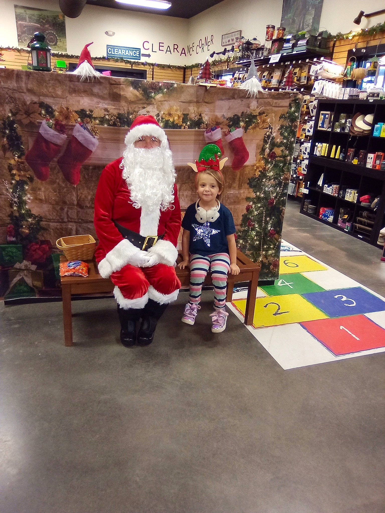 Cheyenne joined the competition — help win amazing prizes! beard, boot, christmas, christmas_decoration, event, fictional_character, flooring, fun, fur, hat, holiday, joy, lap, person, retail, room, santa_claus, service, shelf, toddler