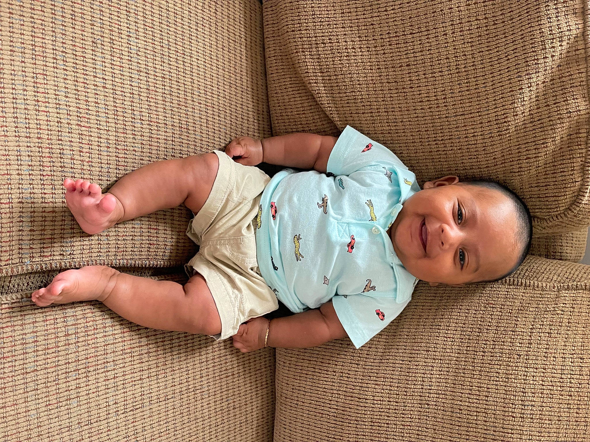 Adrien is registered to the contest to win money with this photo: baby, baby_toddler_clothing, child, comfort, dress, eye, finger, foot, hand, head, headgear, human_body, joy, leg, mammal, pattern, person, skin, sleeve, toddler