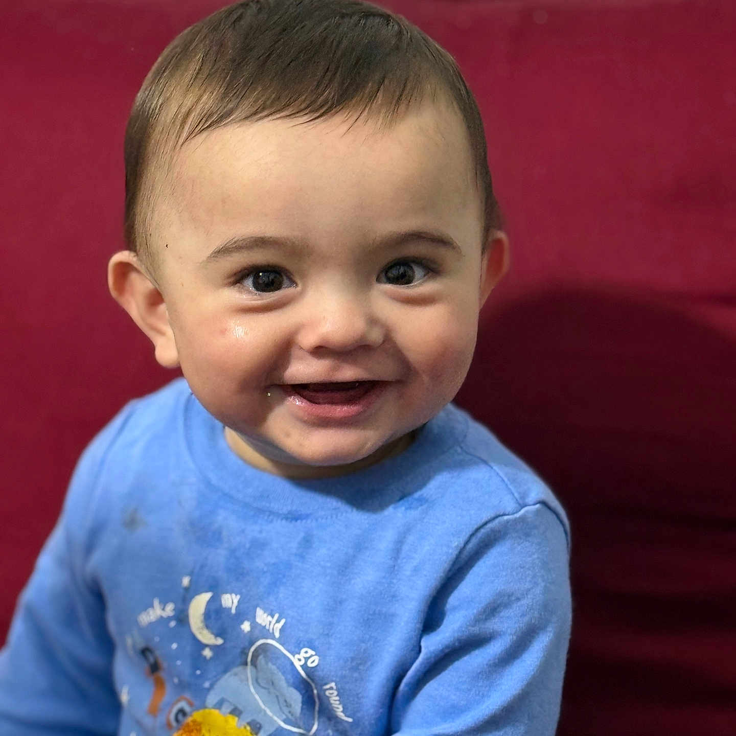 Yunus is registered to the contest to win money with this photo: applique, baby, babylaughing, clothing, couch, cushion, face, furniture, happy, head, homedecor, laughing, longsleeve, pattern, person, photography, portrait, sleeve, smile, t_shirt