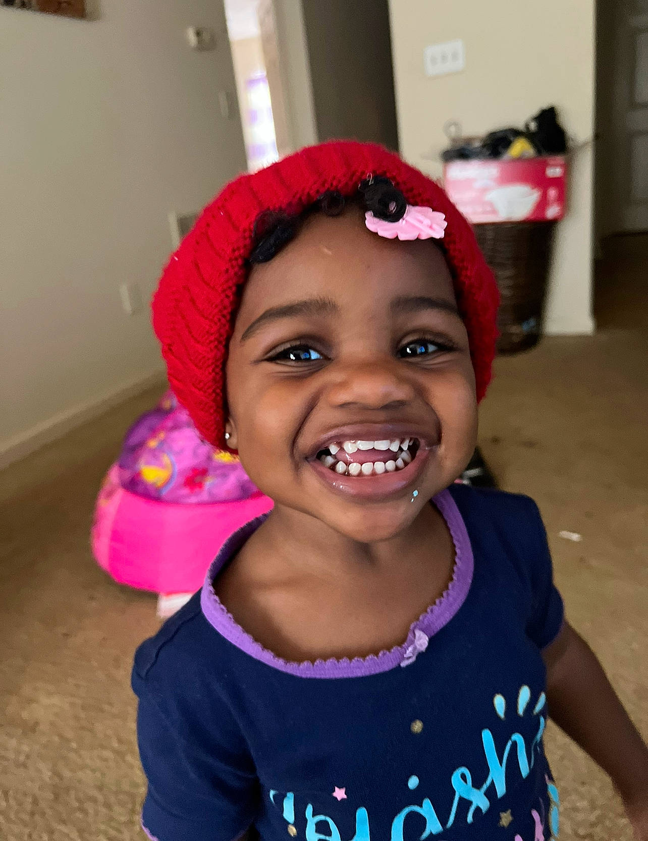 Tylah is registered to the contest to win money with this photo: baby_toddler_clothing, cheek, child, clothing, eyebrow, face, facial_expression, fun, happy, head, joy, lip, magenta, mouth, person, pink, purple, skin, sleeve, smile