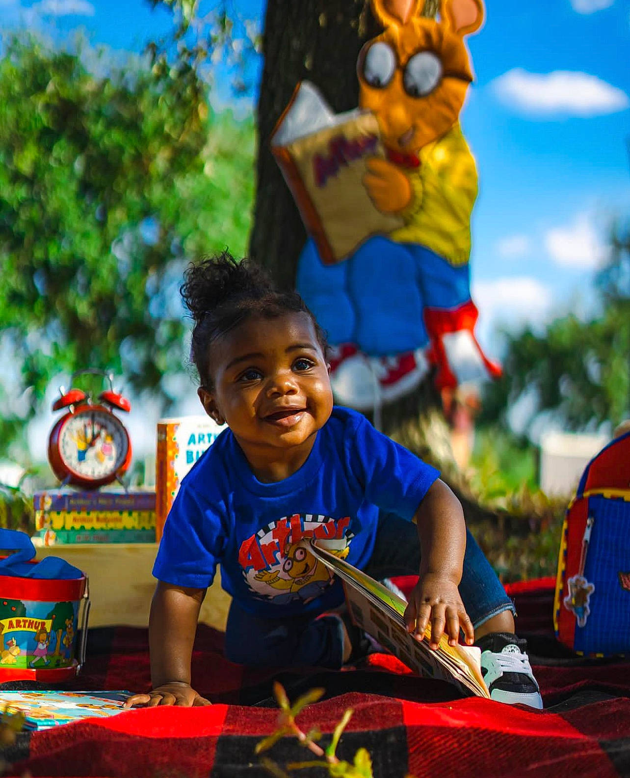 Tylah is registered to the contest to win money with this photo: adaptation, blue, child, facial_expression, fun, happy, human, leisure, light, orange, person, photograph, public_space, recreation, smile, summer, toddler, travel, tree, world