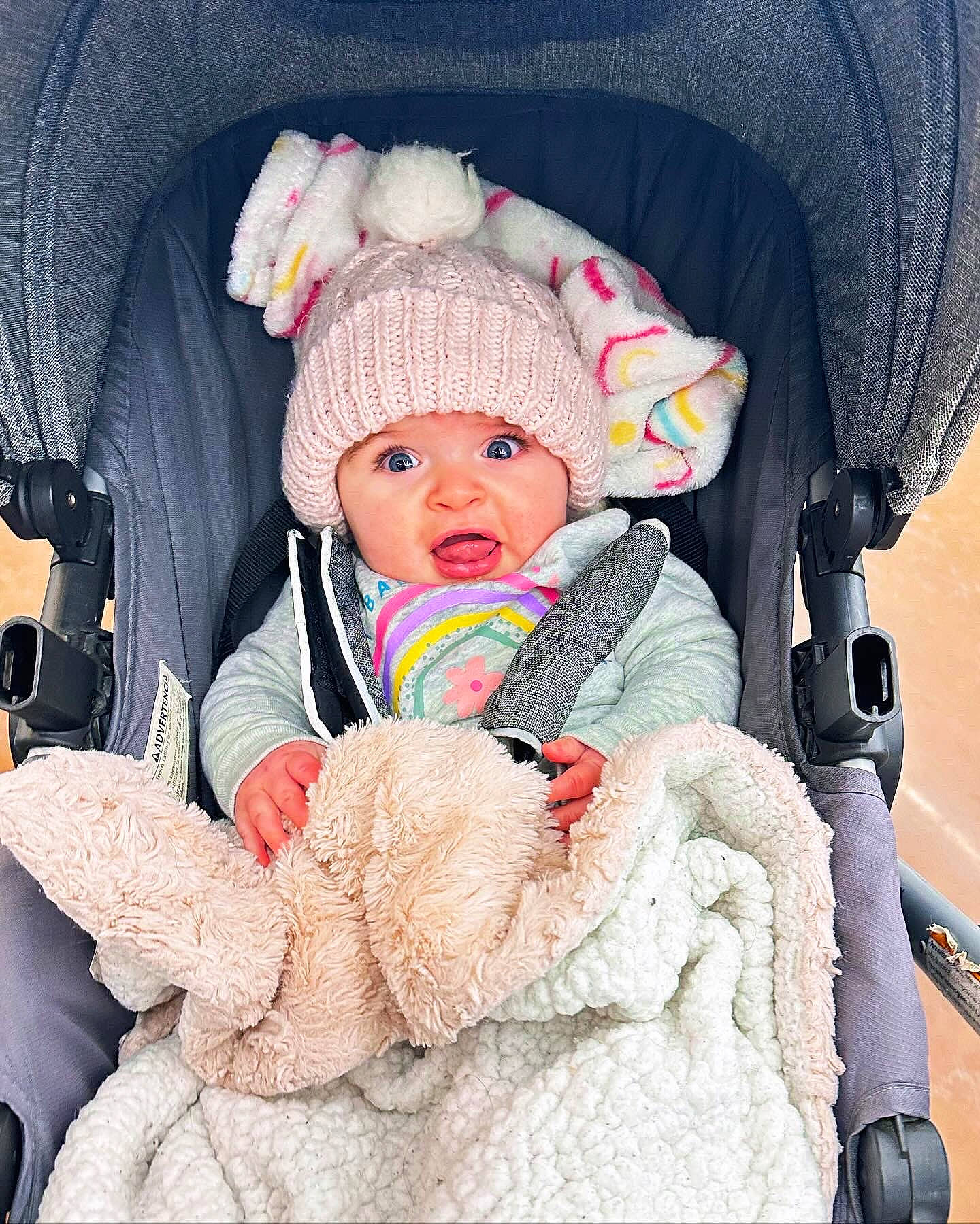 Peyton joined the competition — help win amazing prizes! baby, baby_carriage, baby_products, baby_safety, baby_sleeping, baby_toddler_clothing, cap, car_seat, cheek, child, comfort, headgear, headwear, human, jacket, knit_cap, person, pink, product, skin