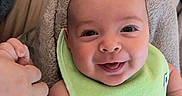 Graysen is registered to the contest to win money with this photo: baby, baby_bottle, bib, blanket, bottle, child, clothing, cute, face, finger, hand, happy, holding_hand, indoor, infant, newborn, person, portrait, skin, smile
