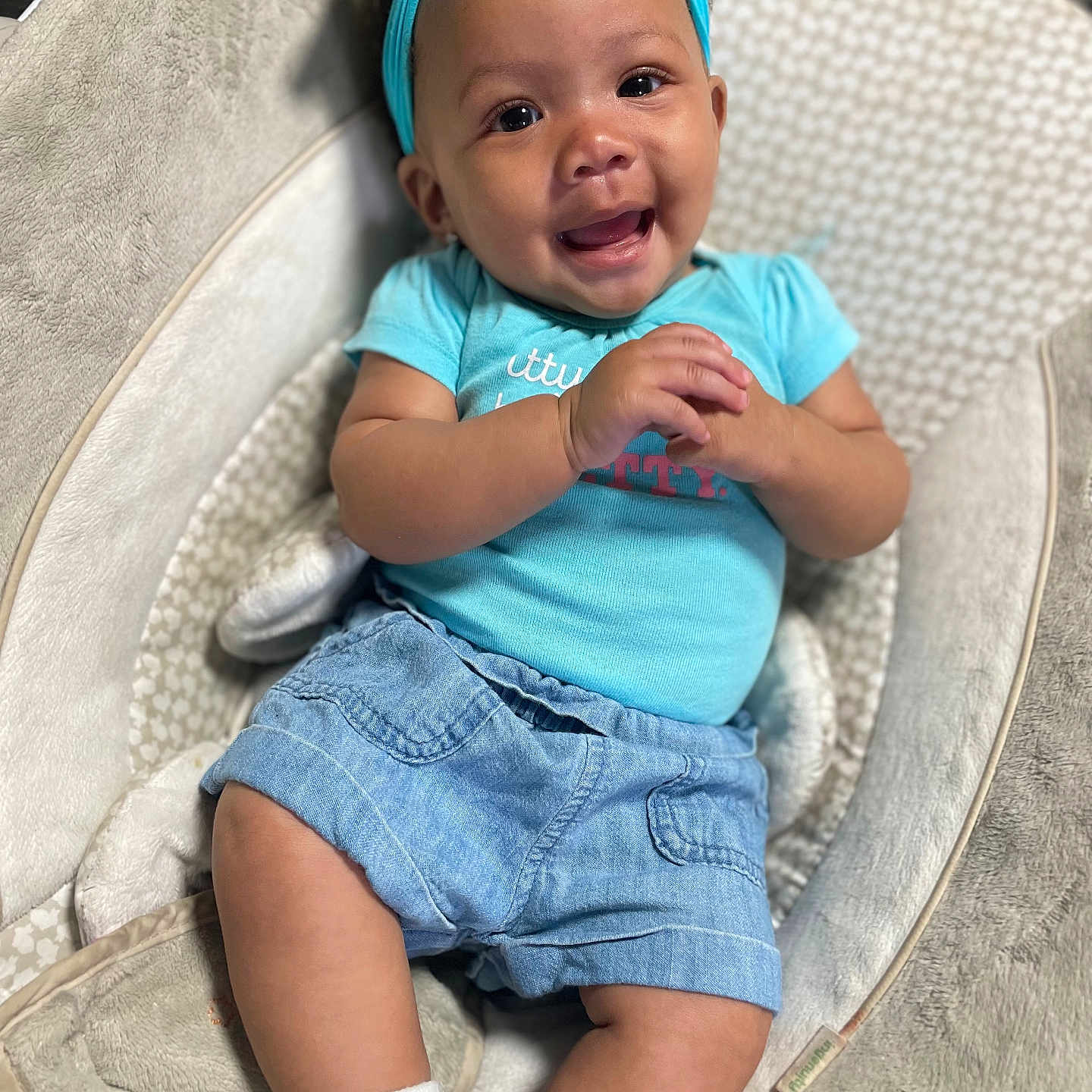 Taliyah is registered to the contest to win money with this photo: baby, clothing, couch, cushion, face, furniture, happy, head, homedecor, hosiery, jeans, pants, person, photography, portrait, shorts, sitting, smile, sock, t_shirt