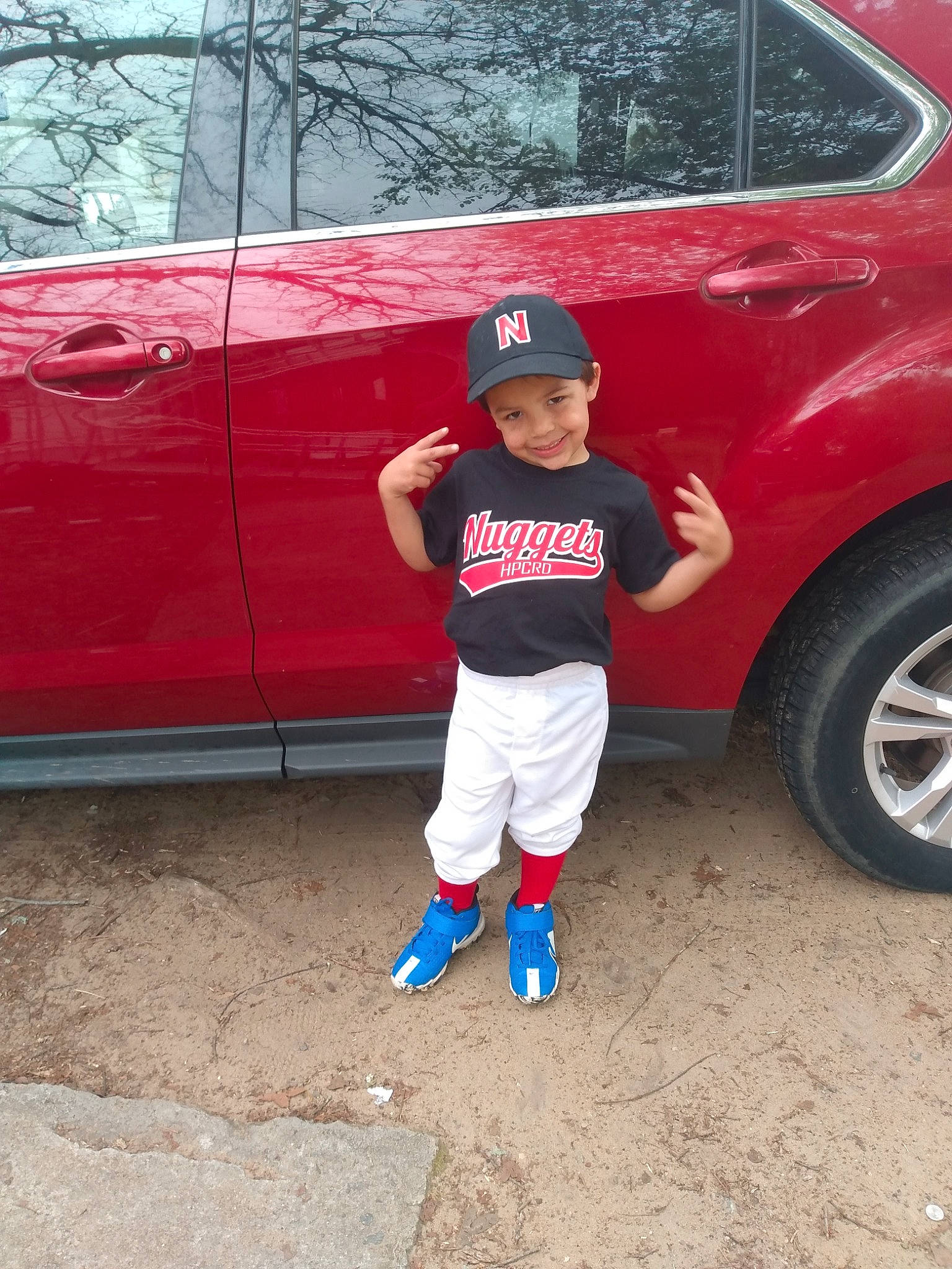 Mikey joined the competition — help win amazing prizes! alloy_wheel, automotive_design, automotive_exterior, automotive_lighting, automotive_tire, bumper, car, fender, headwear, hood, joy, land_vehicle, motor_vehicle, person, rim, t_shirt, tints_and_shades, tire, toddler, tree