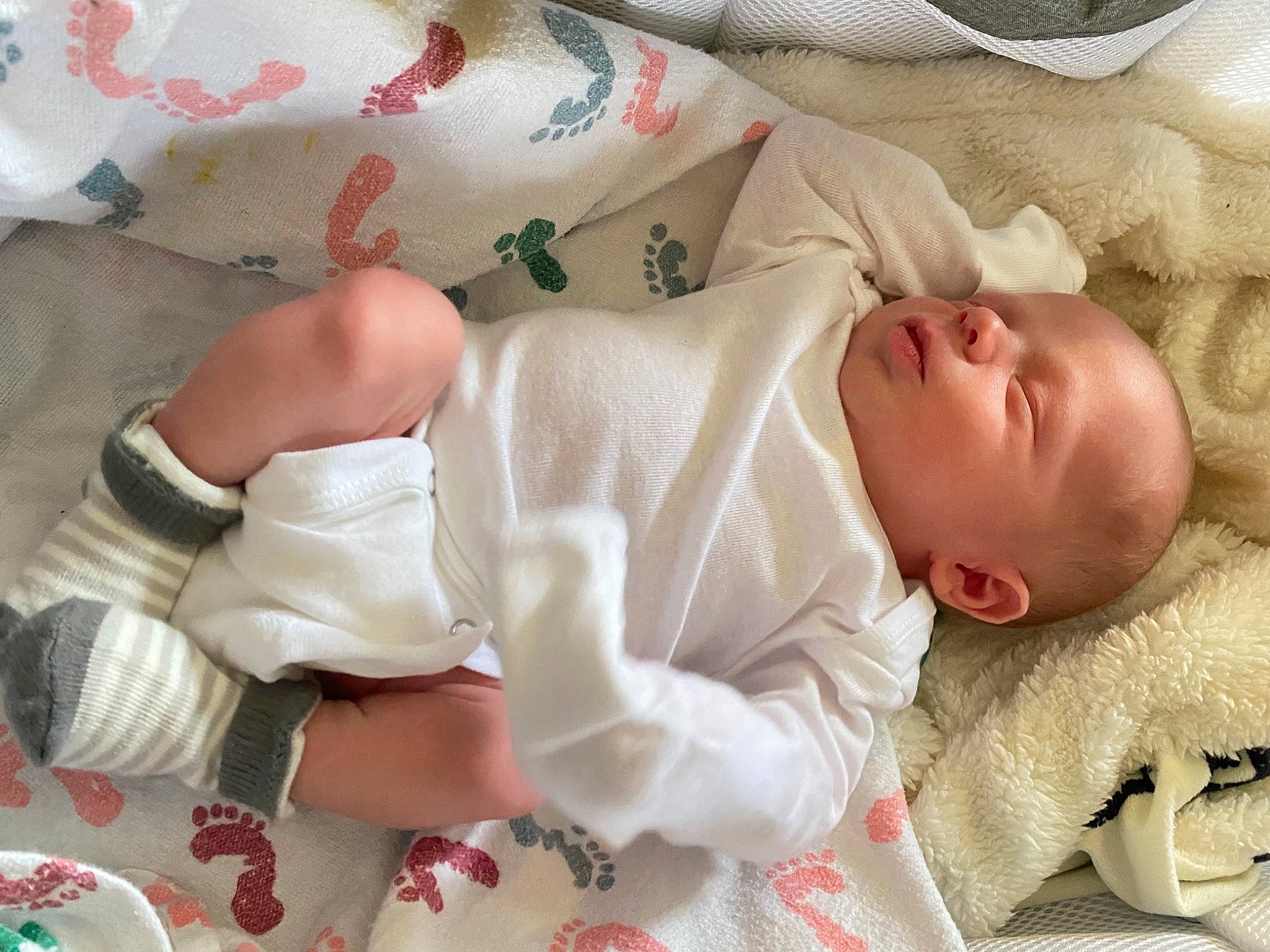Sullivan is registered to the contest to win money with this photo: baby, baby_products, baby_sleeping, baby_toddler_clothing, bedding, bedtime, child, comfort, face, finger, hand, head, linens, mixing_bowl, pattern, person, room, skin, sleeve, tableware