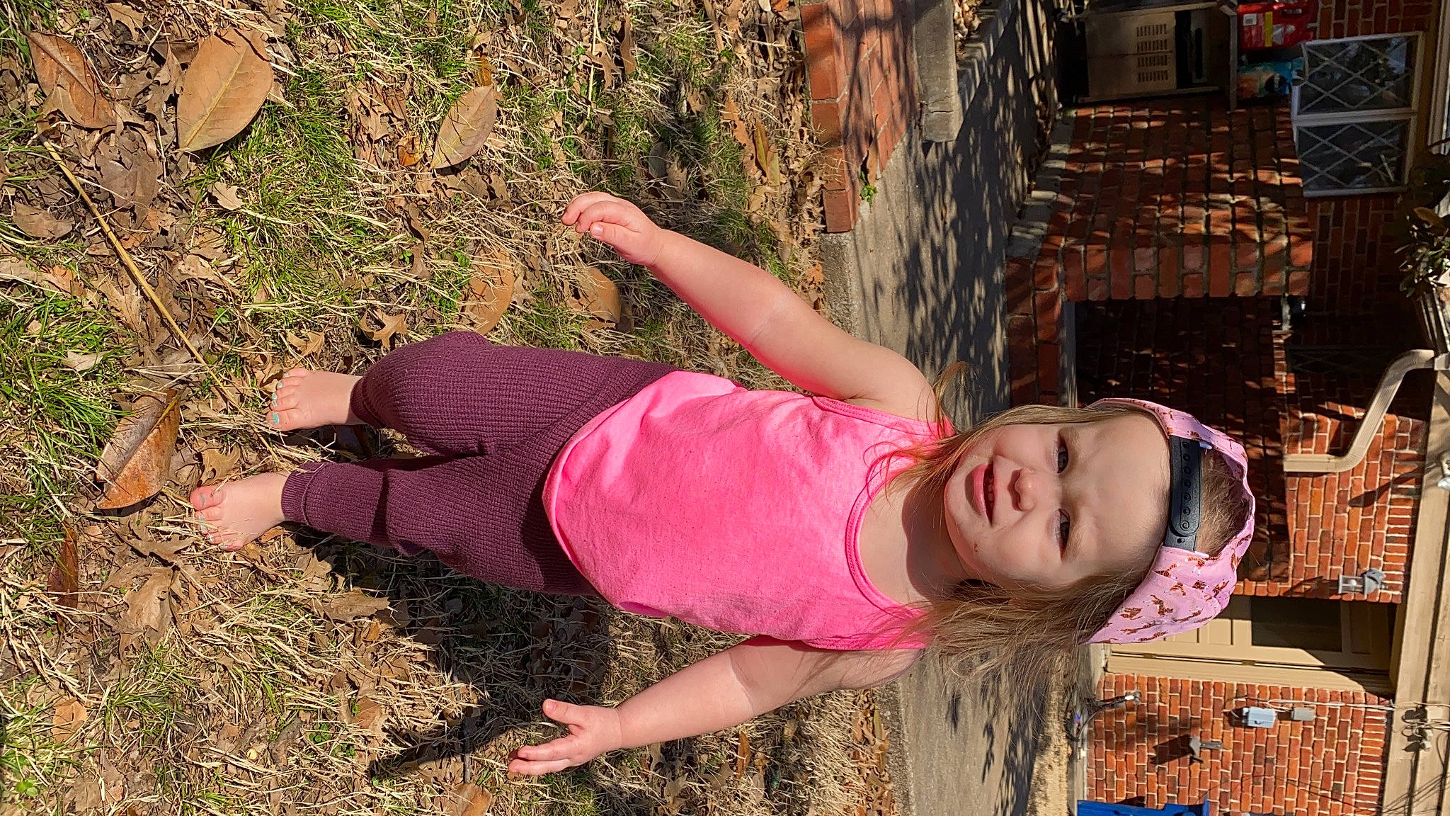 Fenner is registered to the contest to win money with this photo: adaptation, beauty, child, fun, grass, happy, hat, headwear, human_leg, leisure, magenta, people_in_nature, person, pink, plant, soil, t_shirt, thigh, toddler, tree